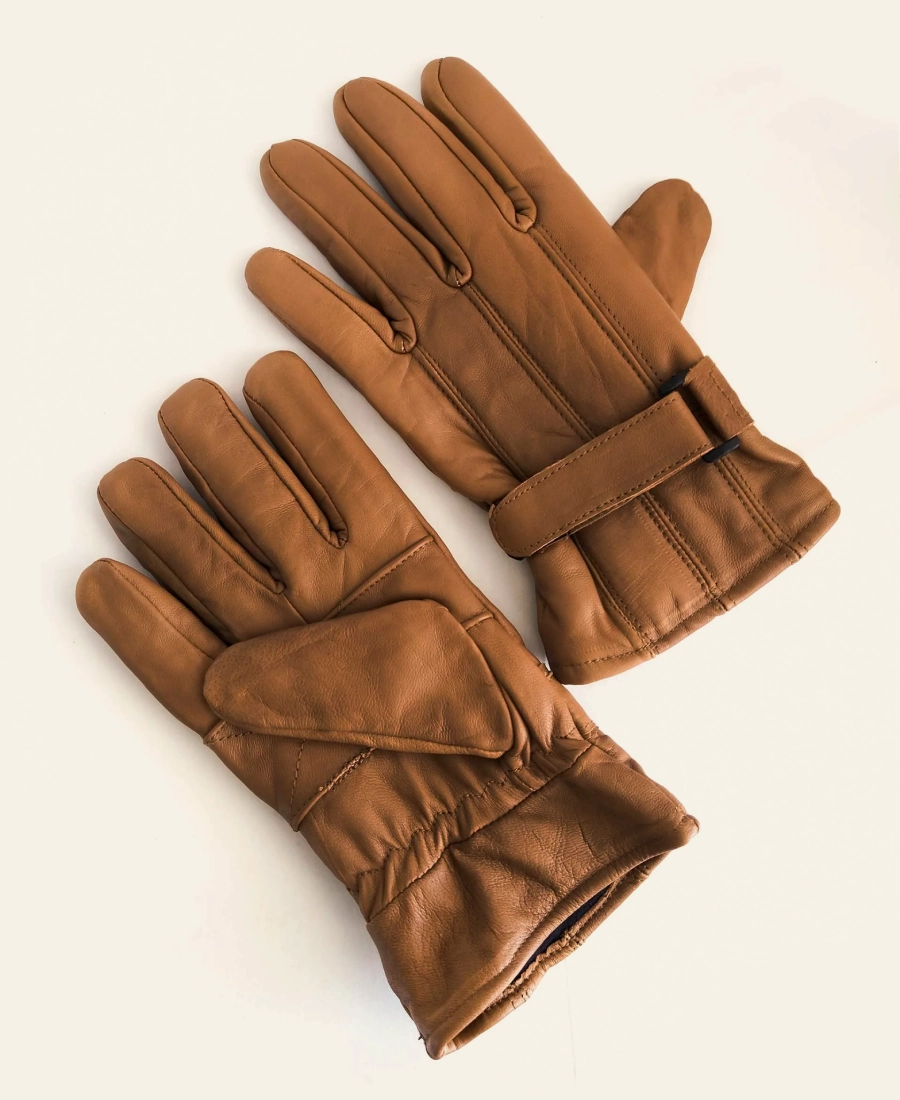 John Dutton Yellowstone Pair of brown leather gloves on a beige background