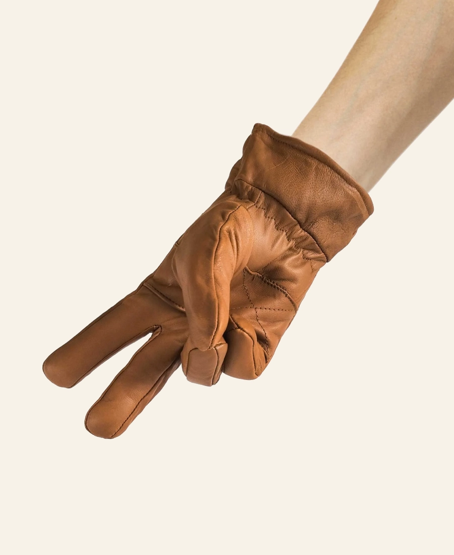 John Dutton Yellowstone Brown leather glove on a beige background