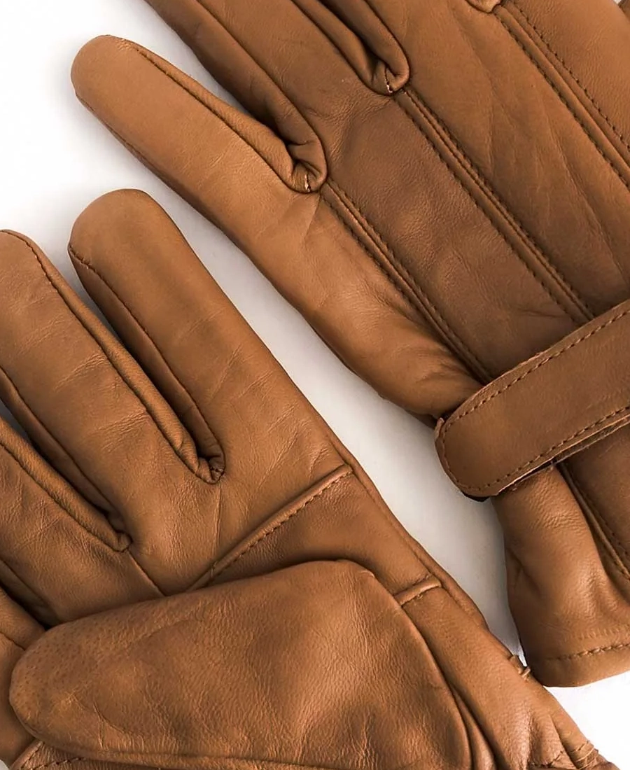 John Dutton Pair of brown leather gloves on a white background