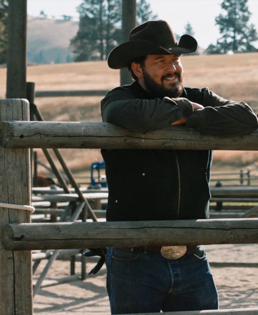 Rip Wheeler wearing a black cowboy hat and Wool Vest