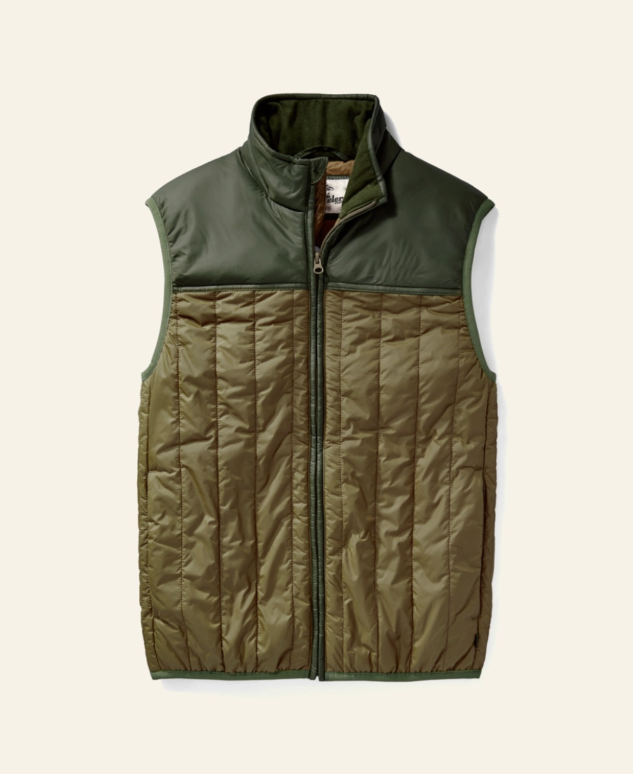 Rip Wheeler Green and brown quilted vest on a light beige background