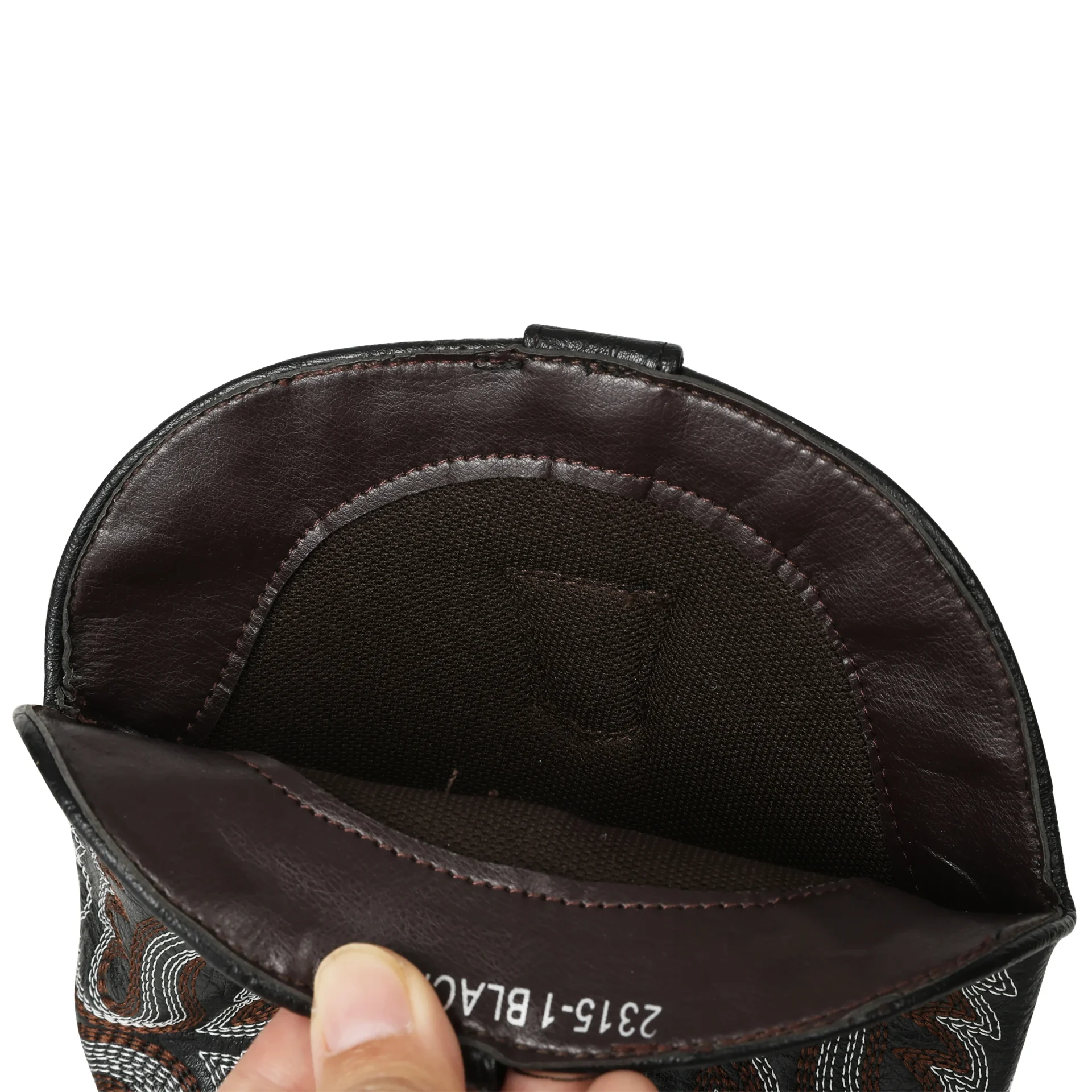 Close-up of a black leather pouch with a hand holding it on a white background