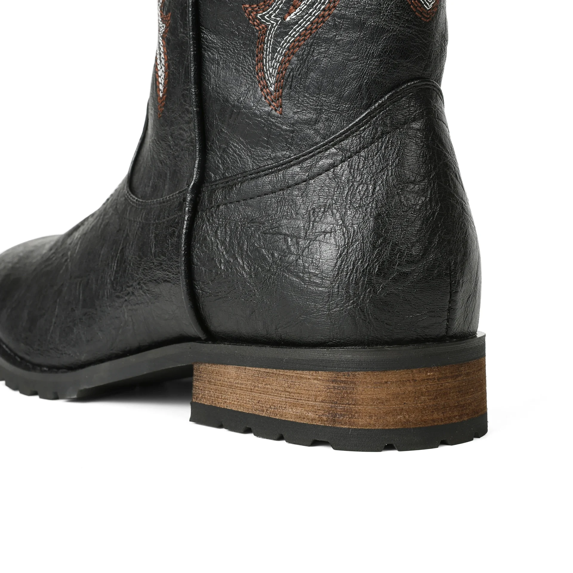 Black leather boot with brown sole on a white background